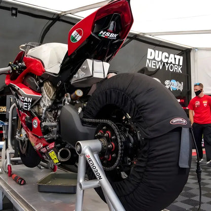 Motocyclette de course rouge et blanche avec Couvertures Chauffe-jantes Programmables Bickle Racing